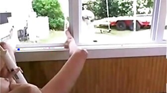 Busty big tit babe fucks pussy in front of window Squirts Hitachi Public Dare